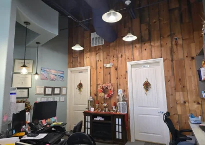Cibola Dental office area with workstations, certifications, and wood accent wall