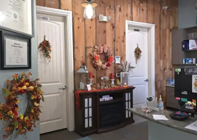 Cibola Dental reception area with wood accent wall and check-in desk